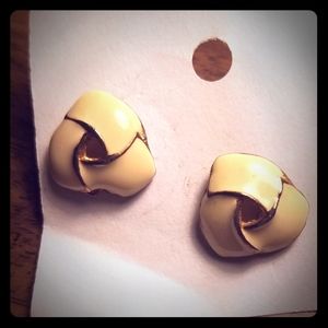 Cream and gold colored earrings